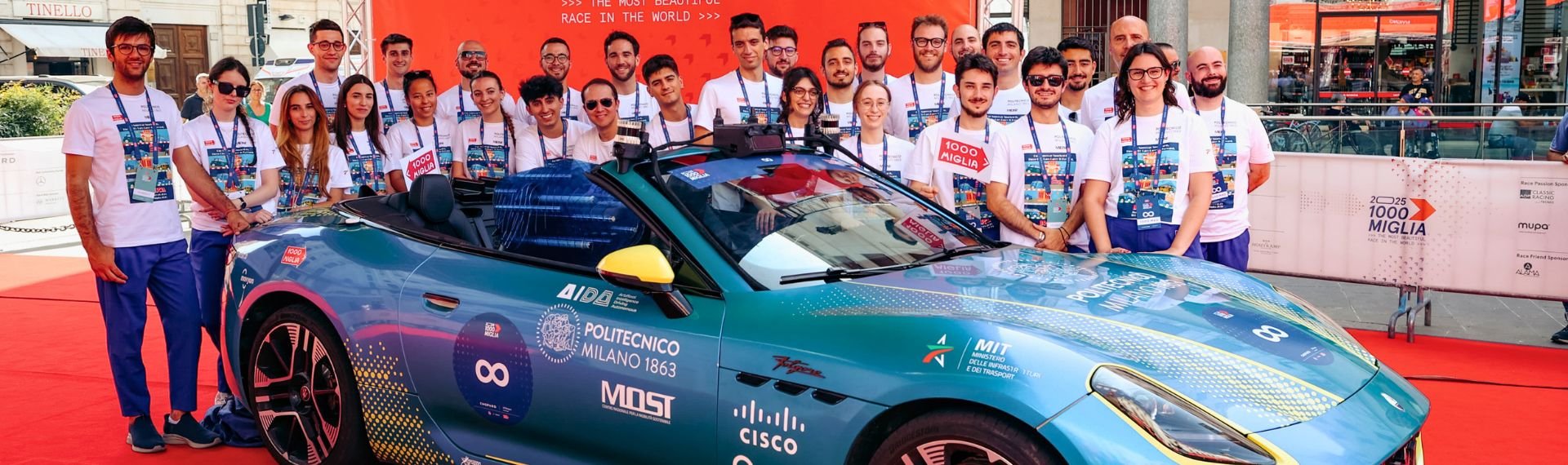 A group of people standing up next to a car.