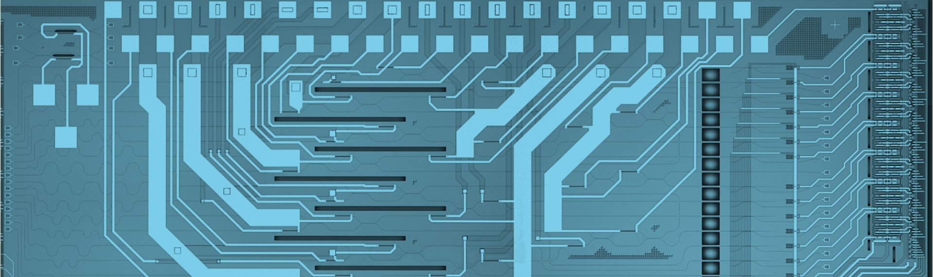 Electronic board with blue and black lines, highlighting circuits and connections.