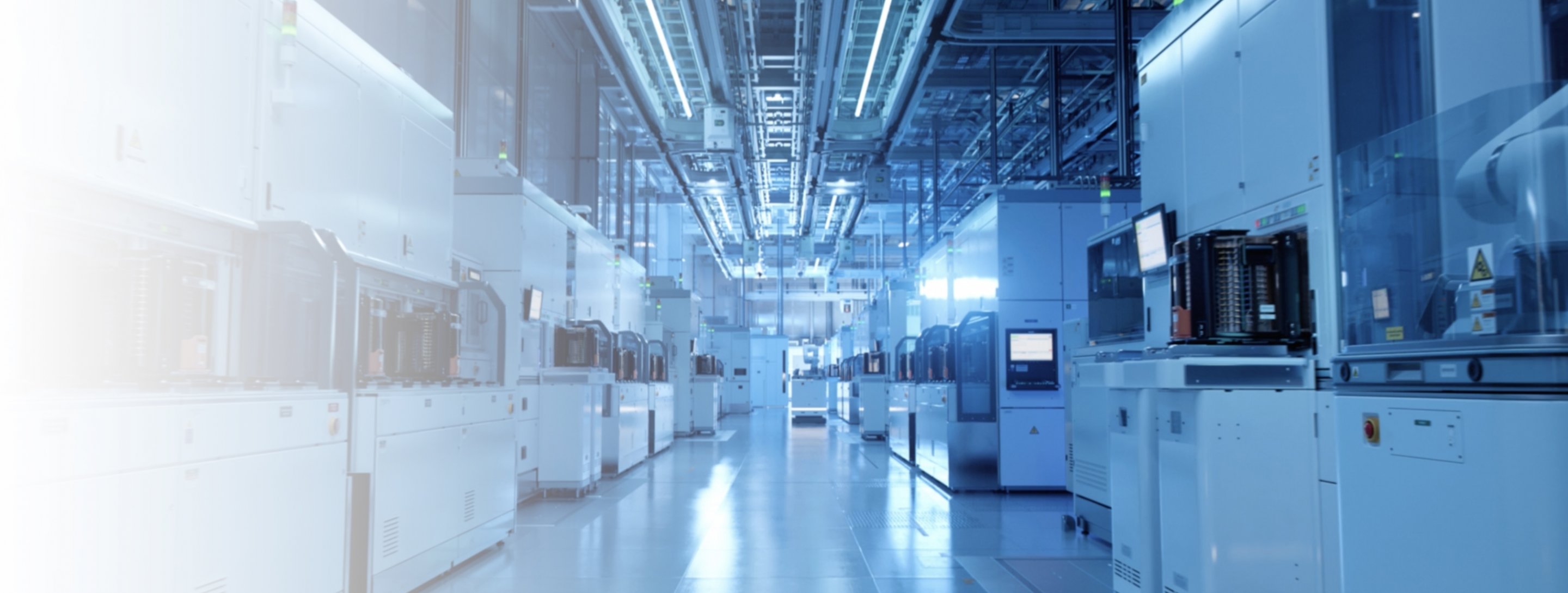A long corridor with scientific equipment neatly arranged along the walls.